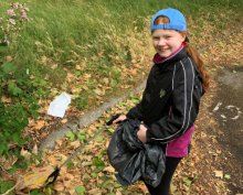 Daisy helps to clear up litter